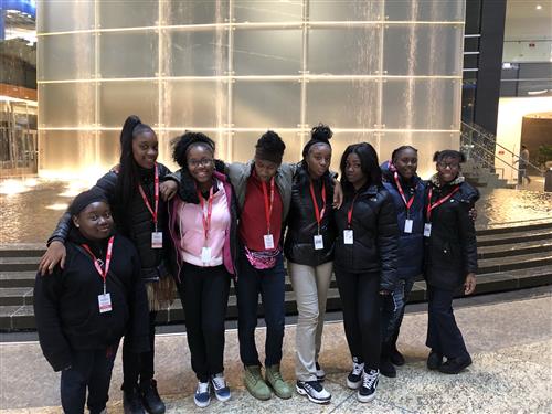 students in front of fountain 